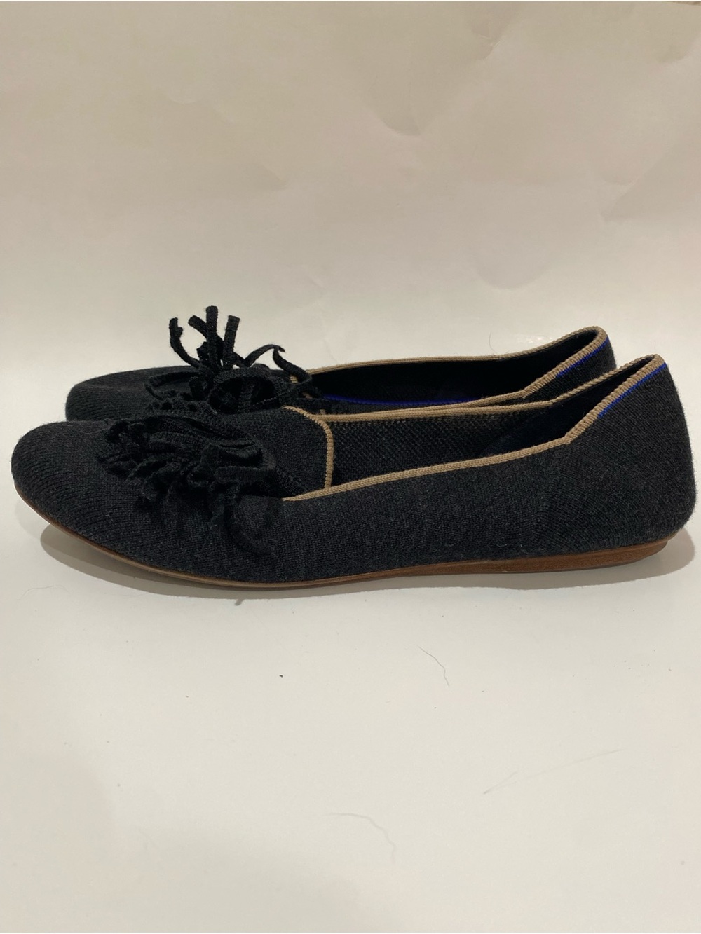 Rothy's Merino Tassel Black Knit Pointed Flats with Tan Trim and Knot Detail